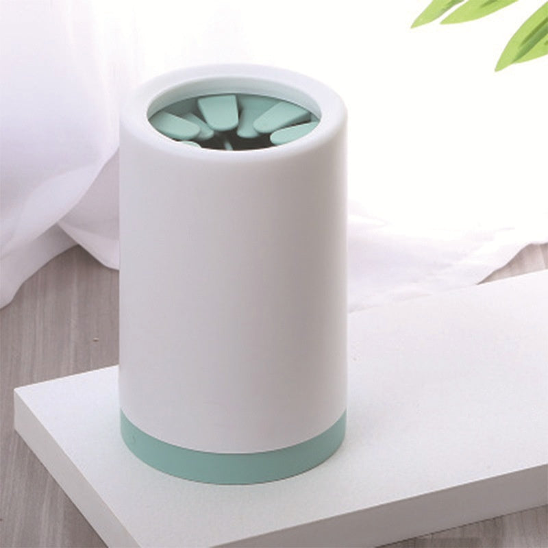 Trailhead Paw Rinse Cup in Sage, styled on a shelf
